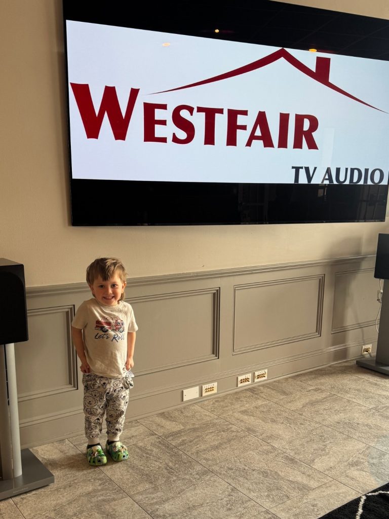 Napoleone, Glenn Levinson's grandson, at the Westfair TV Audio showroom